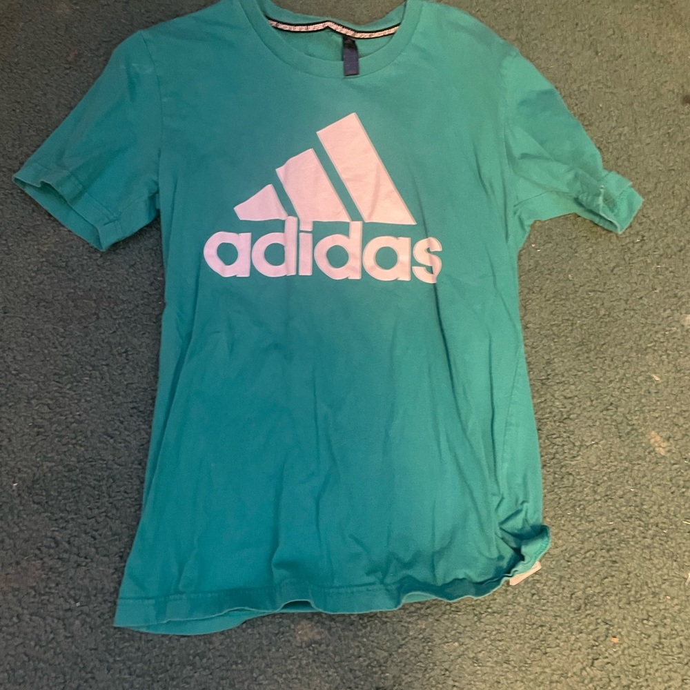 adidas t shirt blue with white name on the front of it size small